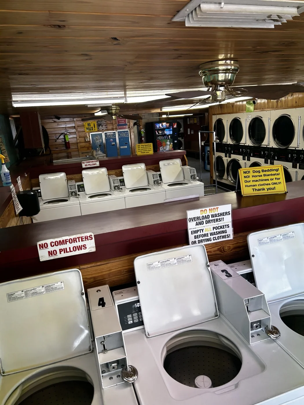 Open top-loading washers in the laundry room
